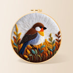 Rustic autumnal bird on golden grasses needle felting kit for beginners with a round wooden frame