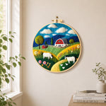 Rustic farmhouse and goats needle felt wall art displayed in a bright home interior