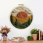 Finished rustic pine forest sunset artwork displayed on a wall