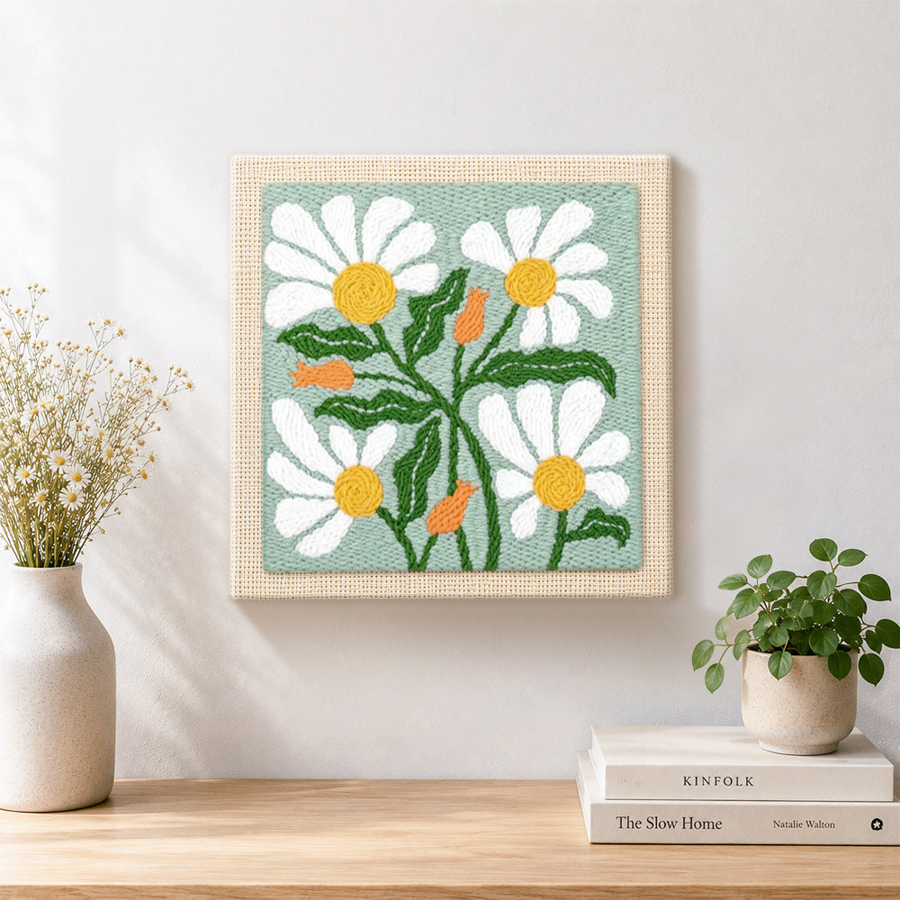 Finished sage green daisies artwork displayed on a wall
