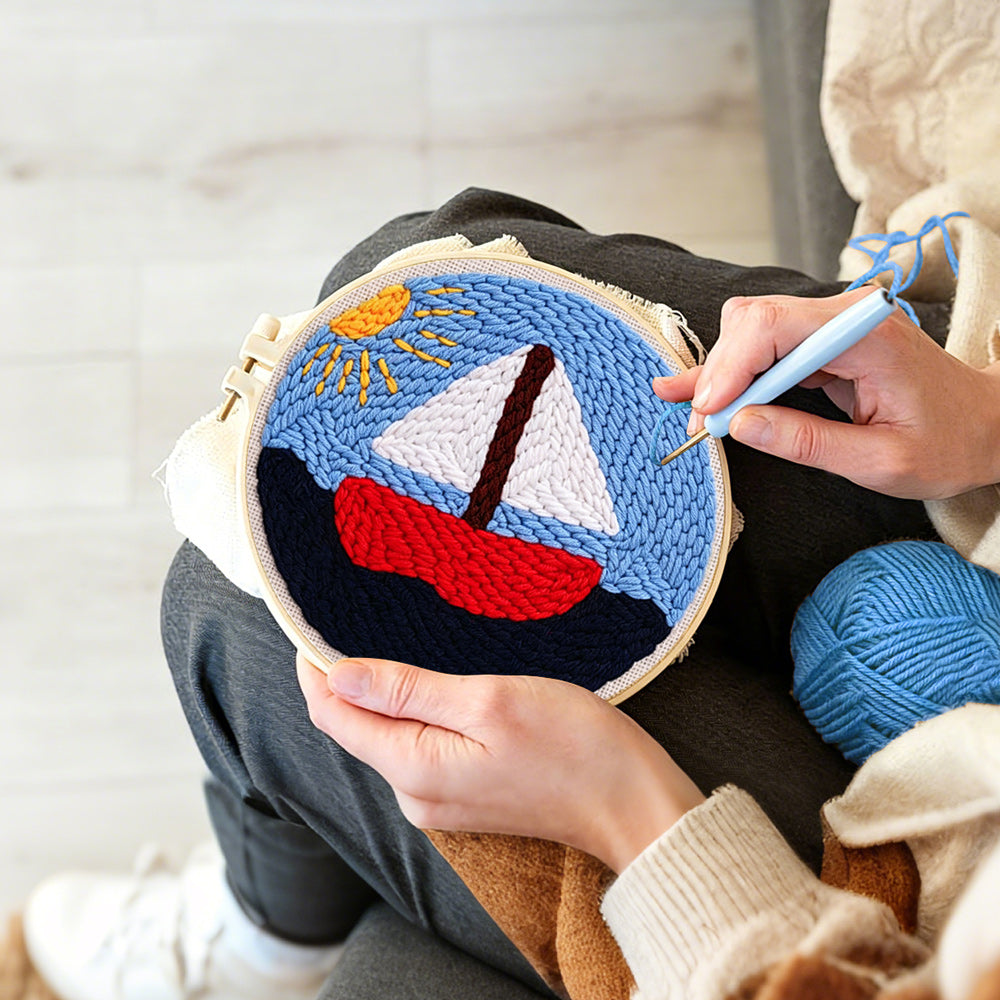 Creating handmade sailboat on the sea under the sunlight punch needle artwork
