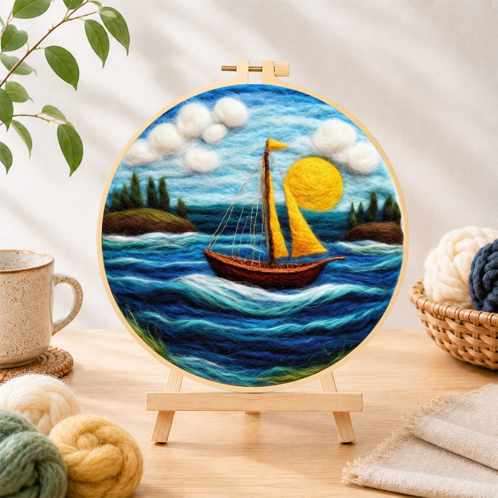 Finished sailing into the sun needle felting displayed on a wooden easel