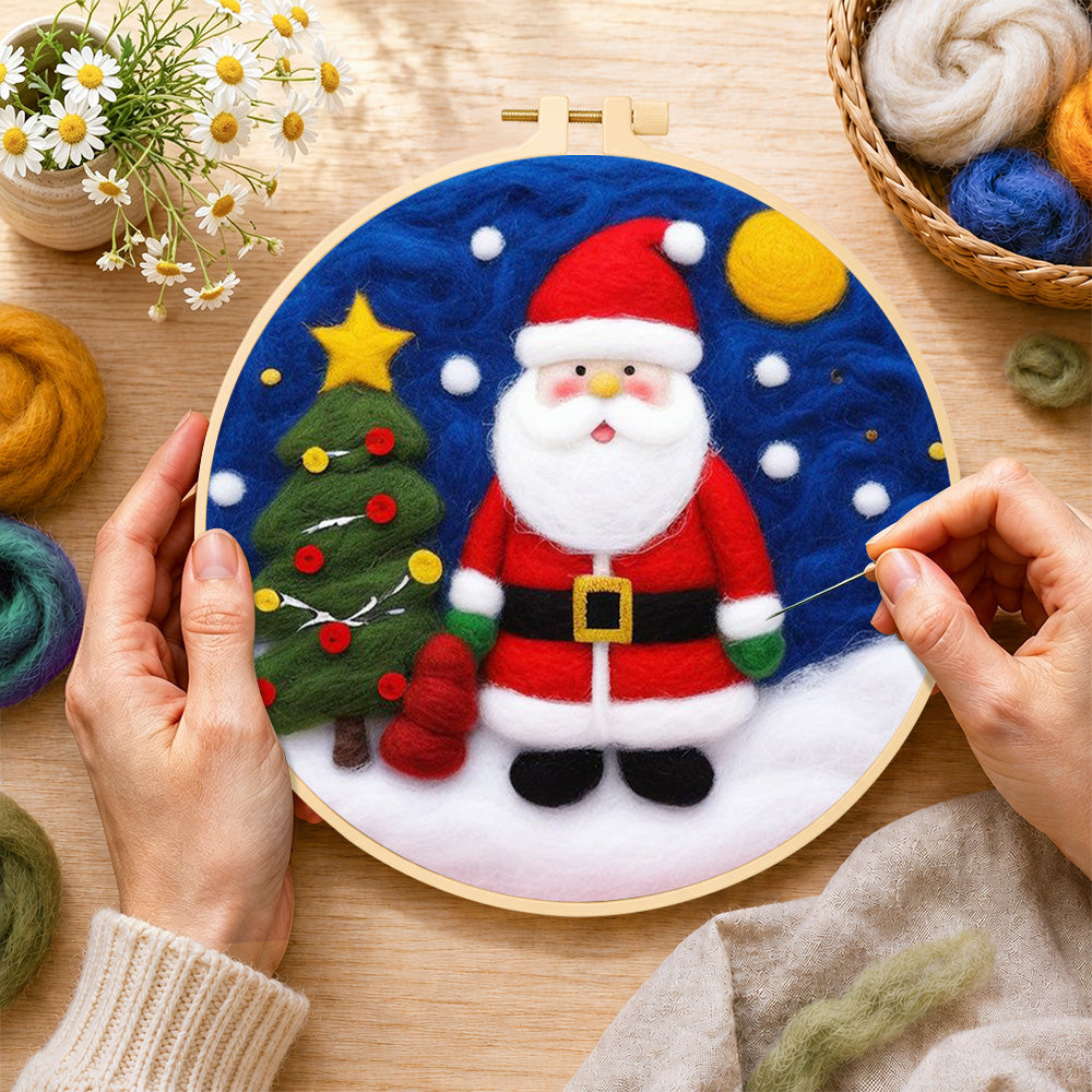 Creating the santa and christmas tree wool painting by hand with a felting needle