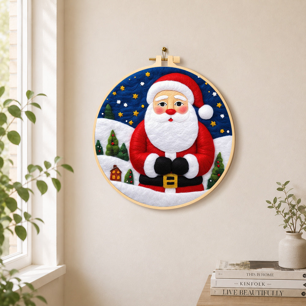Santa with mini village needle felt wall art displayed in a bright home interior