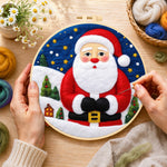 Creating the santa with mini village wool painting by hand with a felting needle