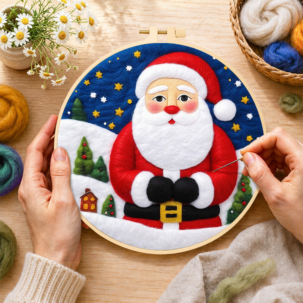 Creating the santa with mini village wool painting by hand with a felting needle