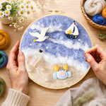 Creating the seagull, crab and sailboat wool painting by hand with a felting needle