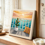 Seaview balcony sunset and potted plant punch needle artwork displayed on a table