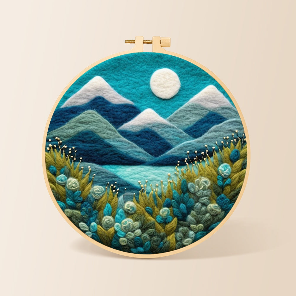 Serene blue mountain with textured floral foliage needle felting kit for beginners with a round wooden frame