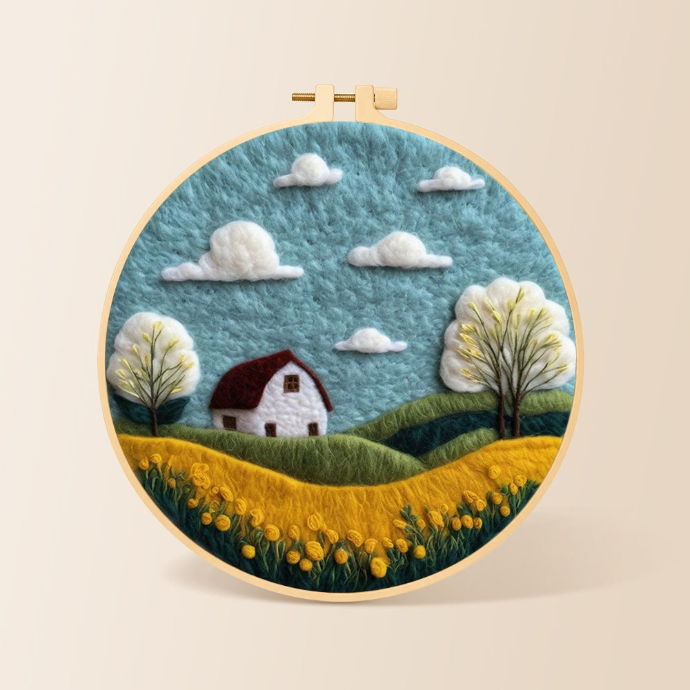 Serene blue sky and golden field needle felting kit for beginners with a round wooden frame