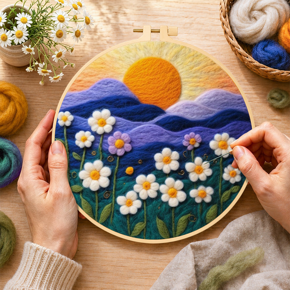 Creating the serene mountain sunset and white daisies wool painting by hand with a felting needle