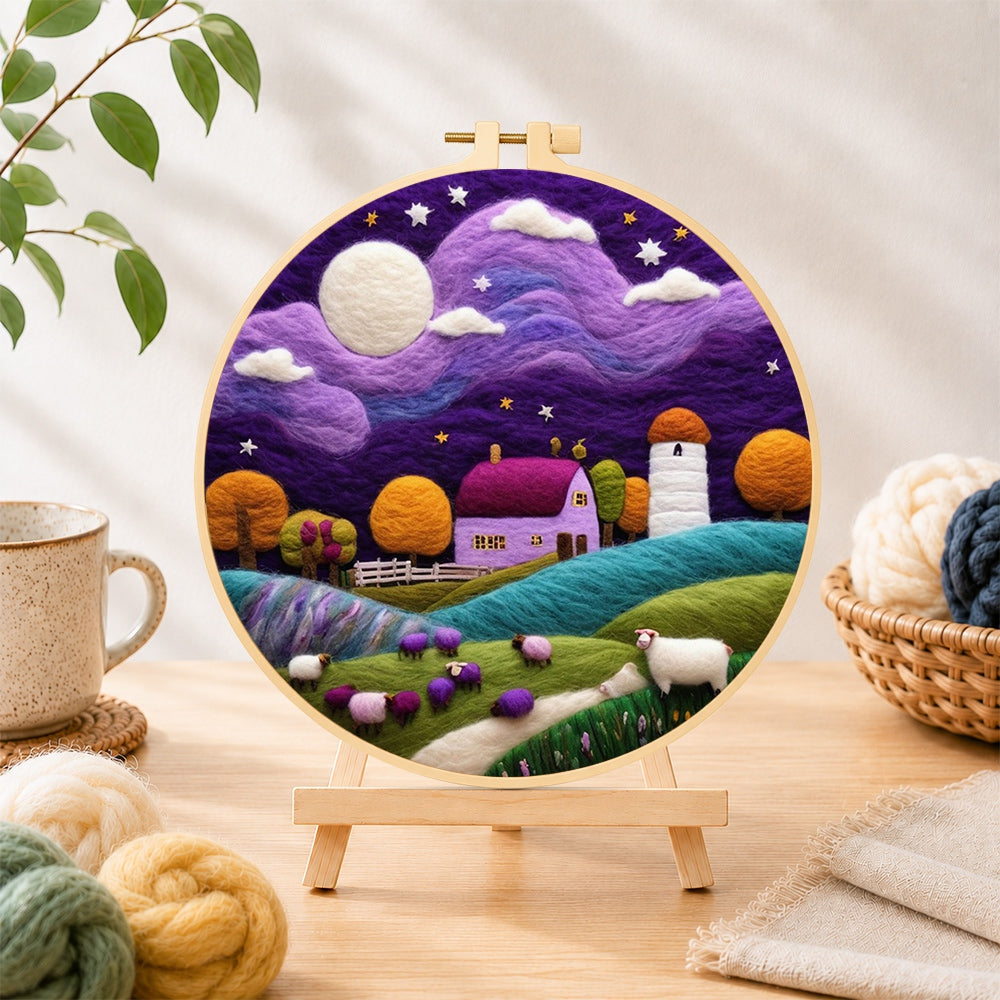 Finished sheep under the dreamy purple night sky needle felting displayed on a wooden easel