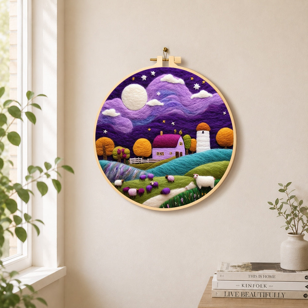 Sheep under the dreamy purple night sky needle felt wall art displayed in a bright home interior
