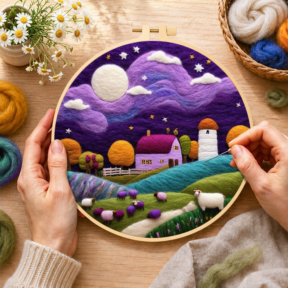 Creating the sheep under the dreamy purple night sky wool painting by hand with a felting needle