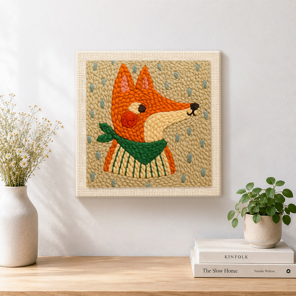 Finished side-profile fox with green scarf artwork displayed on a wall