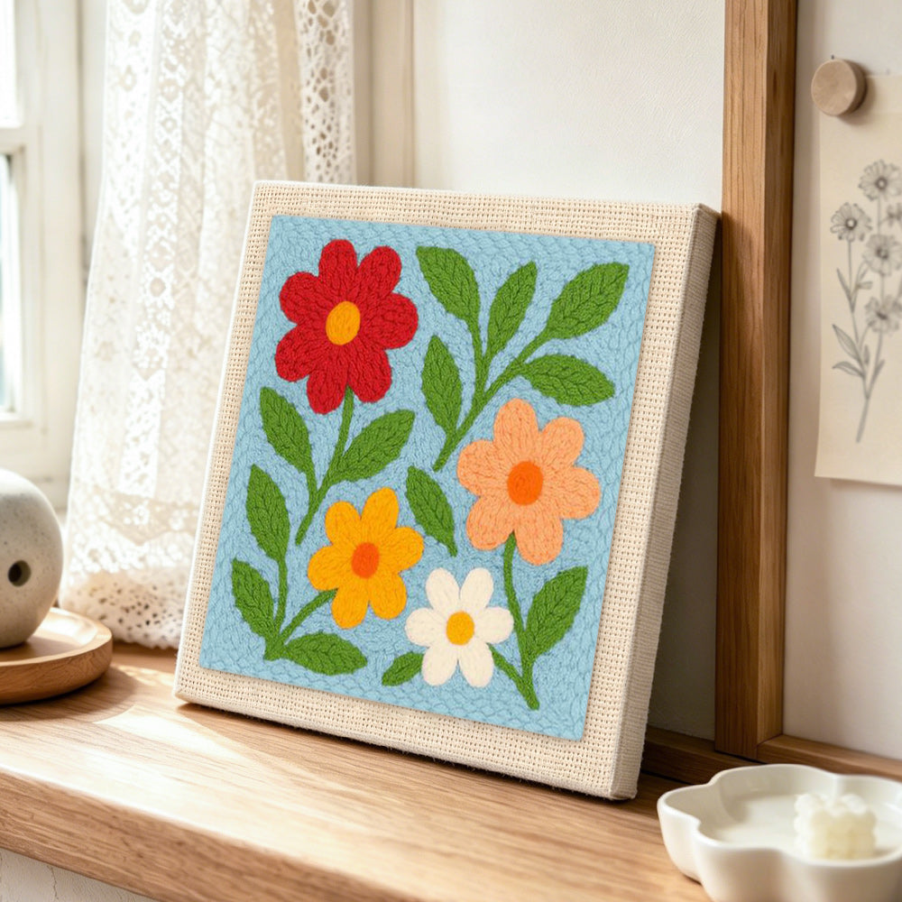 Simple and colourful wildflowers punch needle artwork displayed on a table