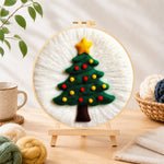 Finished simple green christmas tree needle felting displayed on a wooden easel