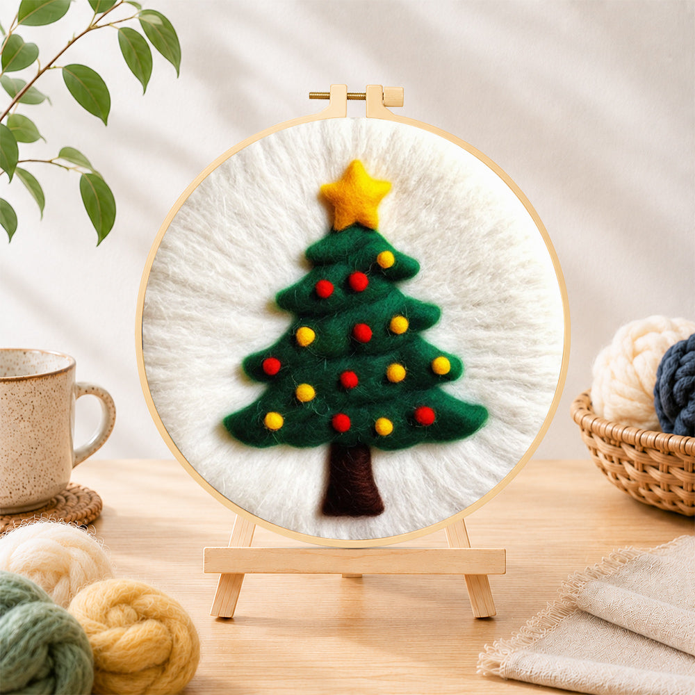 Finished simple green christmas tree needle felting displayed on a wooden easel