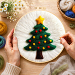 Creating the simple green christmas tree wool painting by hand with a felting needle