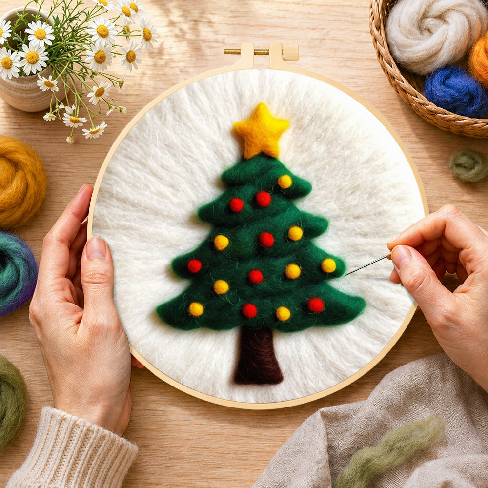 Creating the simple green christmas tree wool painting by hand with a felting needle