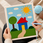 Creating handmade simple sunny house and green tree punch needle artwork