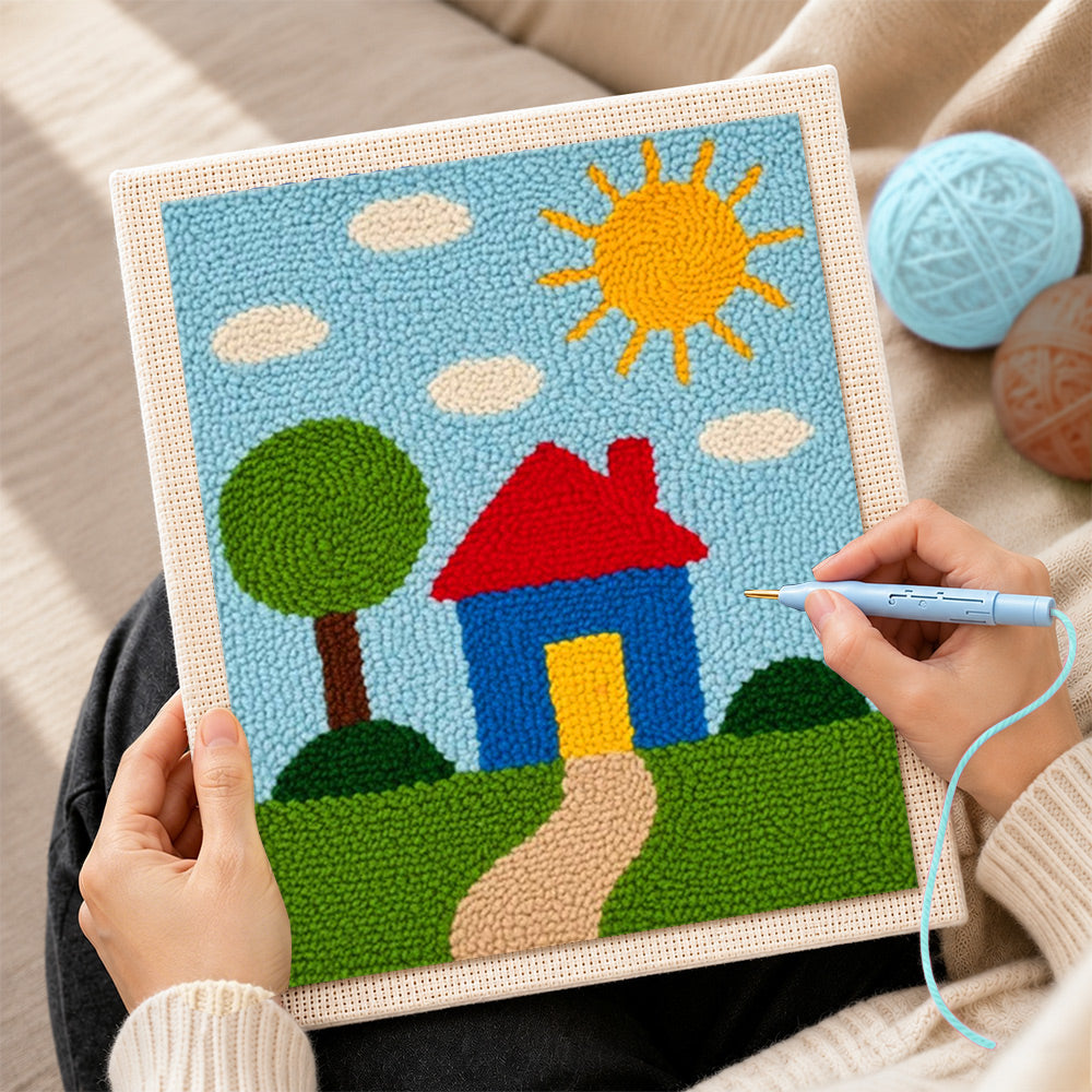 Creating handmade simple sunny house and green tree punch needle artwork
