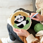 Creating handmade sitting cute panda punch needle artwork