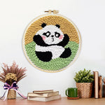 Finished sitting cute panda artwork displayed on a wall