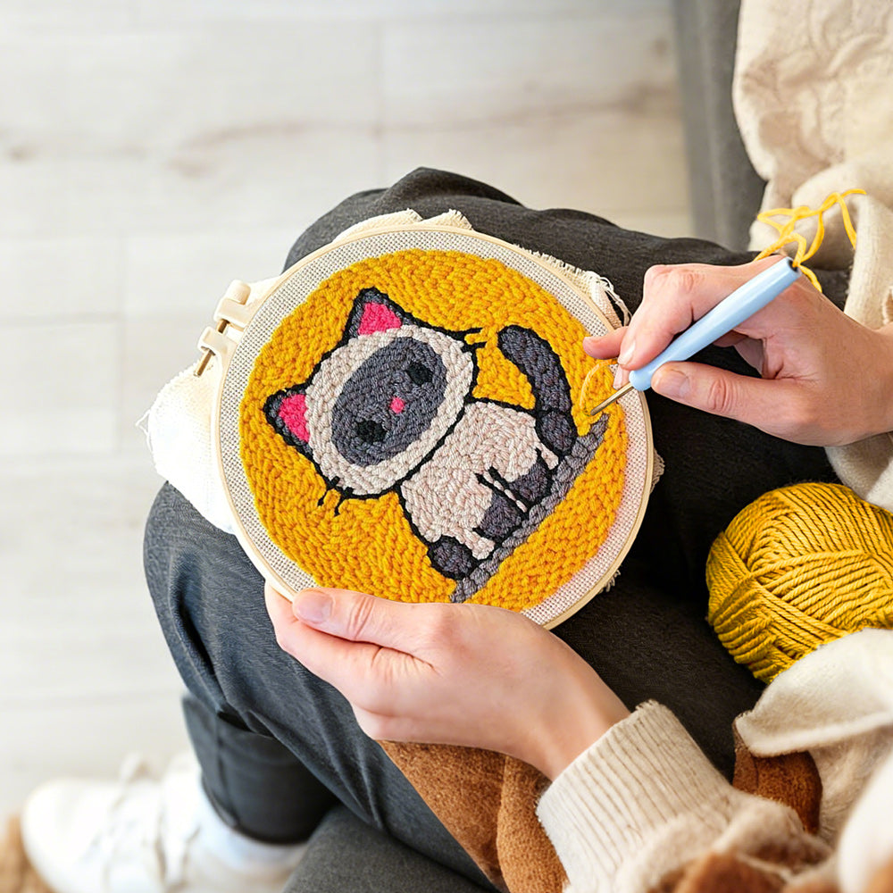 Creating handmade sitting kitten punch needle artwork