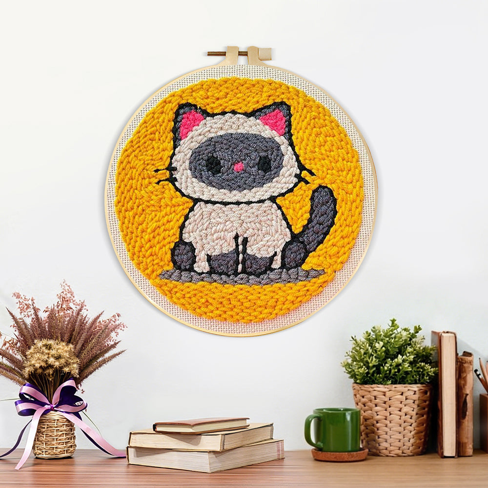 Finished sitting kitten artwork displayed on a wall