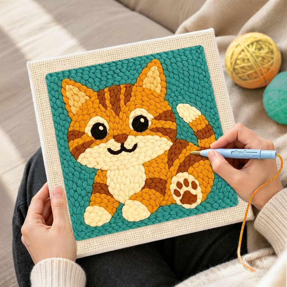 Creating handmade sitting orange tabby cat punch needle artwork