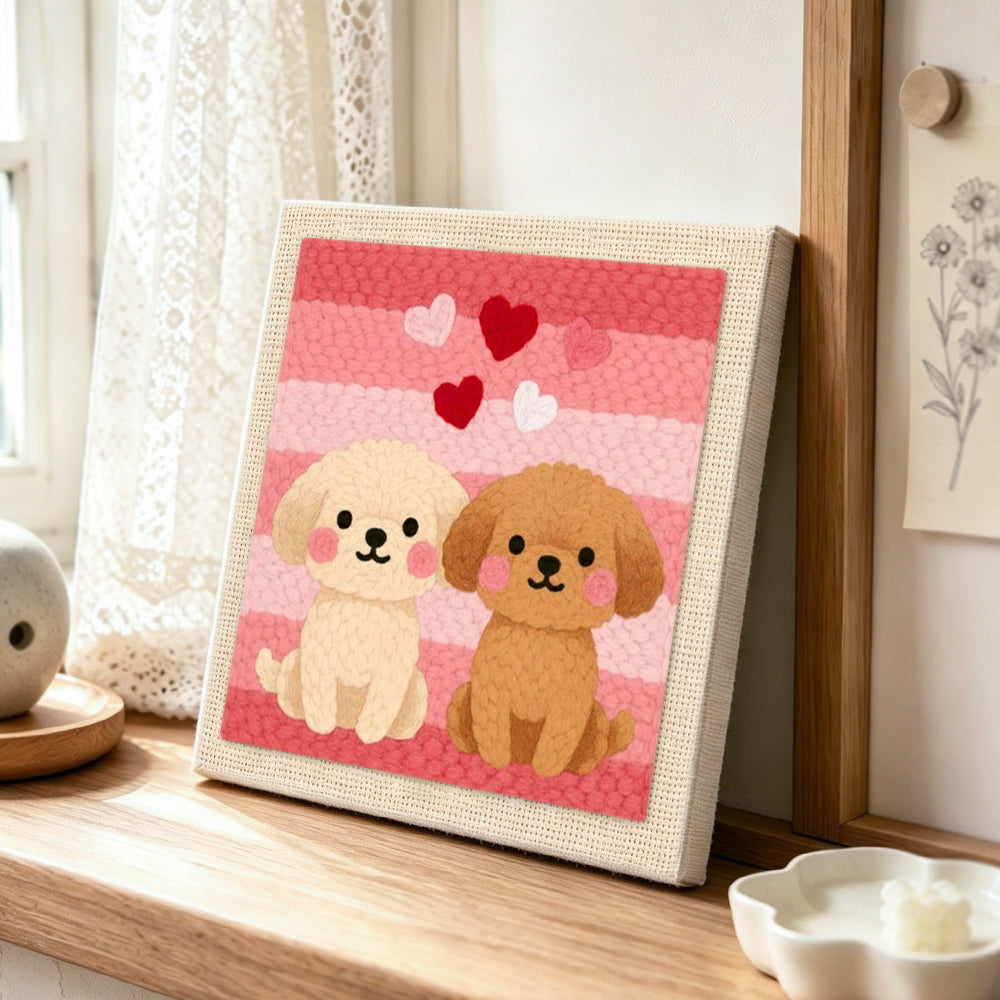 Sitting puppies and romantic hearts punch needle artwork displayed on a table