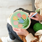 Creating handmade six pastel tulips punch needle artwork