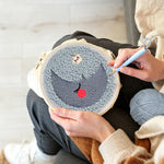 Creating handmade sleeping crescent moon and star punch needle artwork