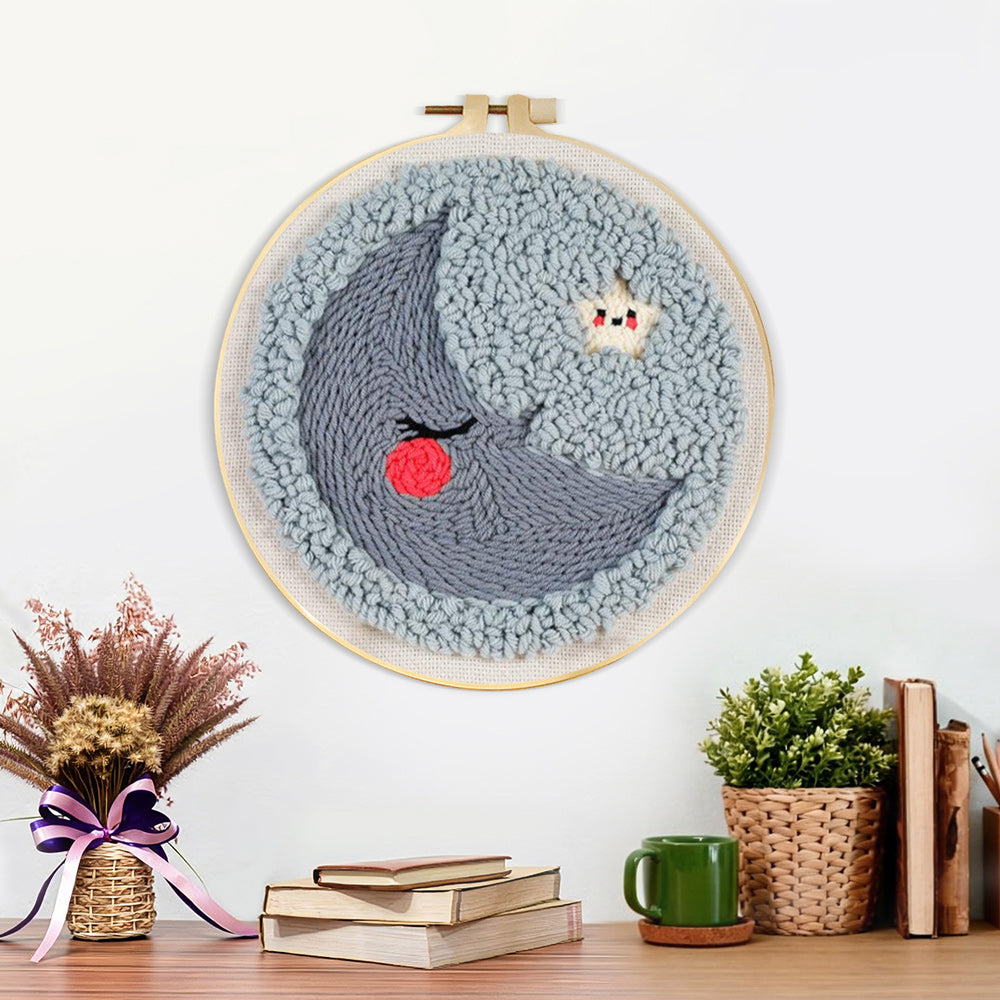 Finished sleeping crescent moon and star artwork displayed on a wall