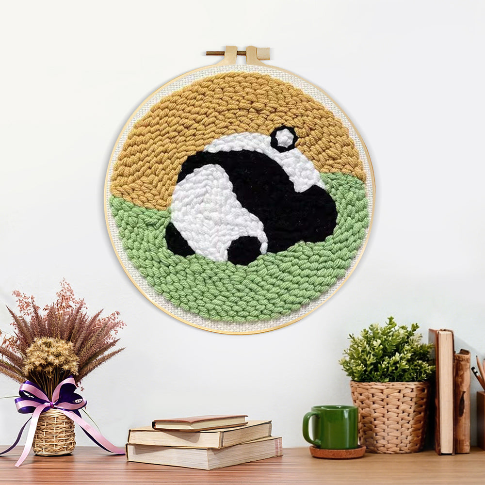 Finished sleeping curled panda artwork displayed on a wall