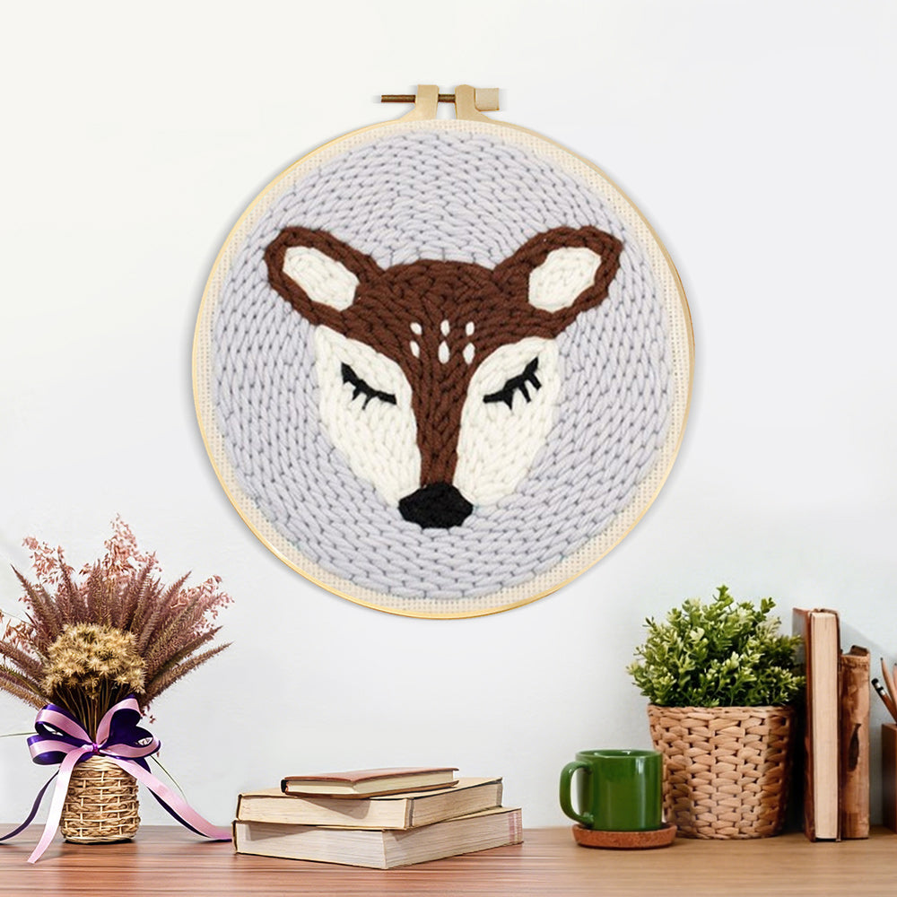Finished sleeping deer artwork displayed on a wall