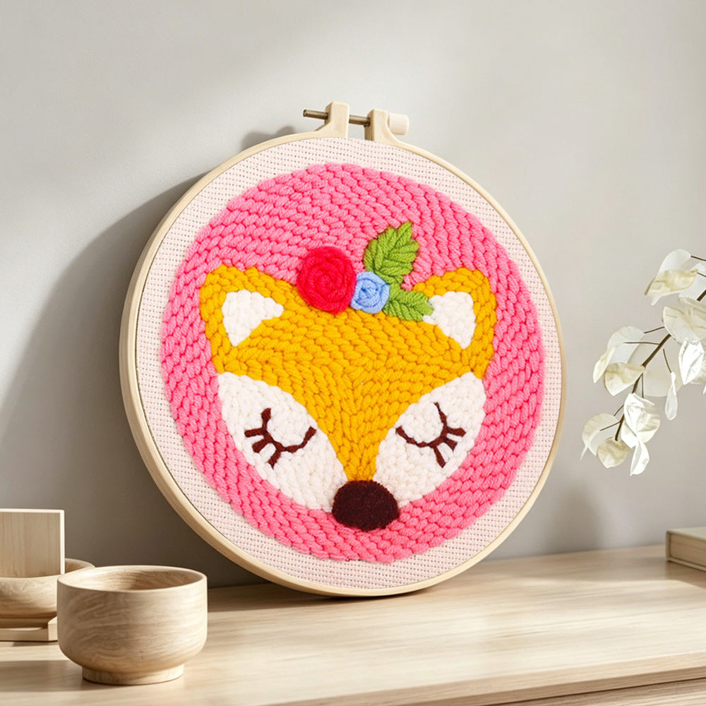 Sleeping little fox punch needle artwork displayed on a table