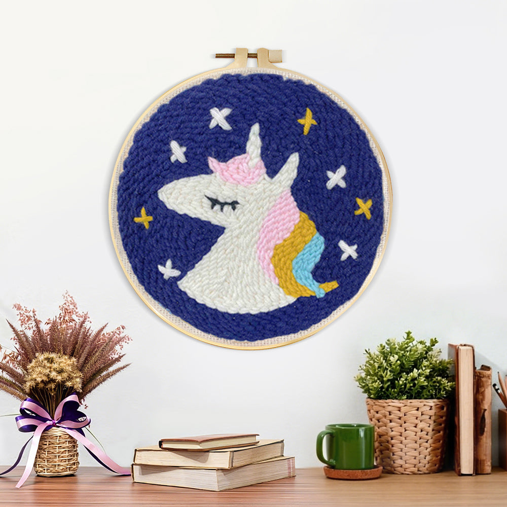 Finished sleeping unicorn under stars artwork displayed on a wall