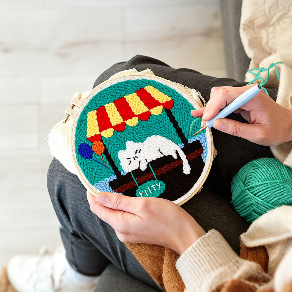 Creating handmade sleeping white cat punch needle artwork