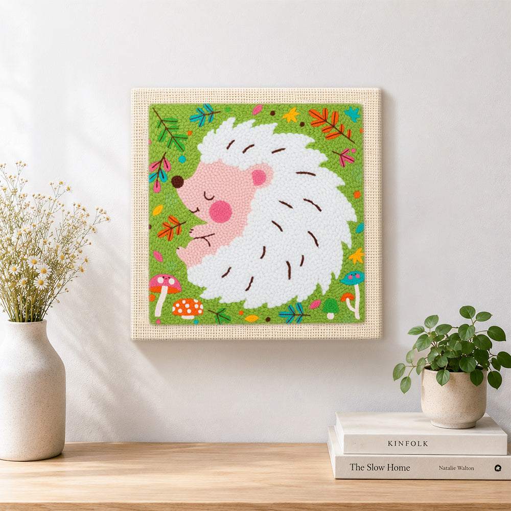 Finished sleeping white hedgehog artwork displayed on a wall