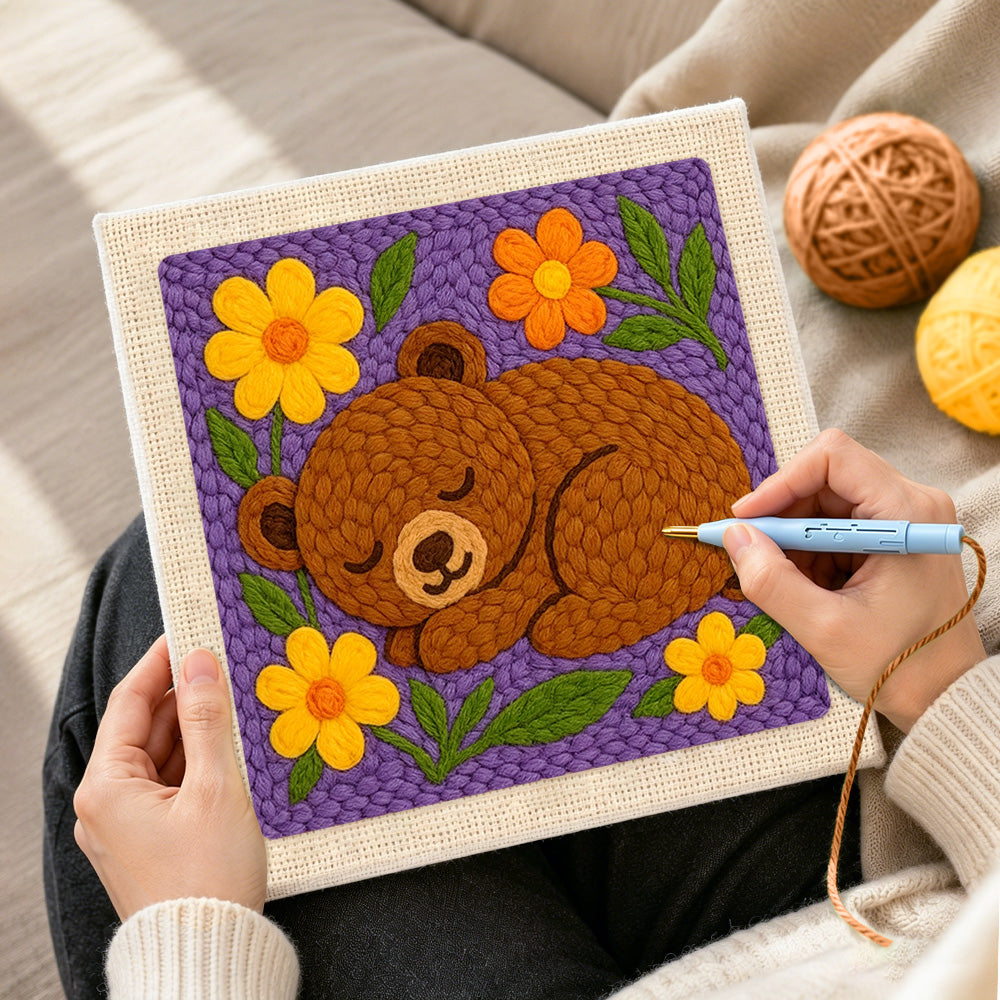 Creating handmade sleepy bear with flowers punch needle artwork