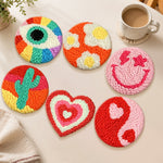 Smiley, cactus and heart punch needle coasters used for home decoration