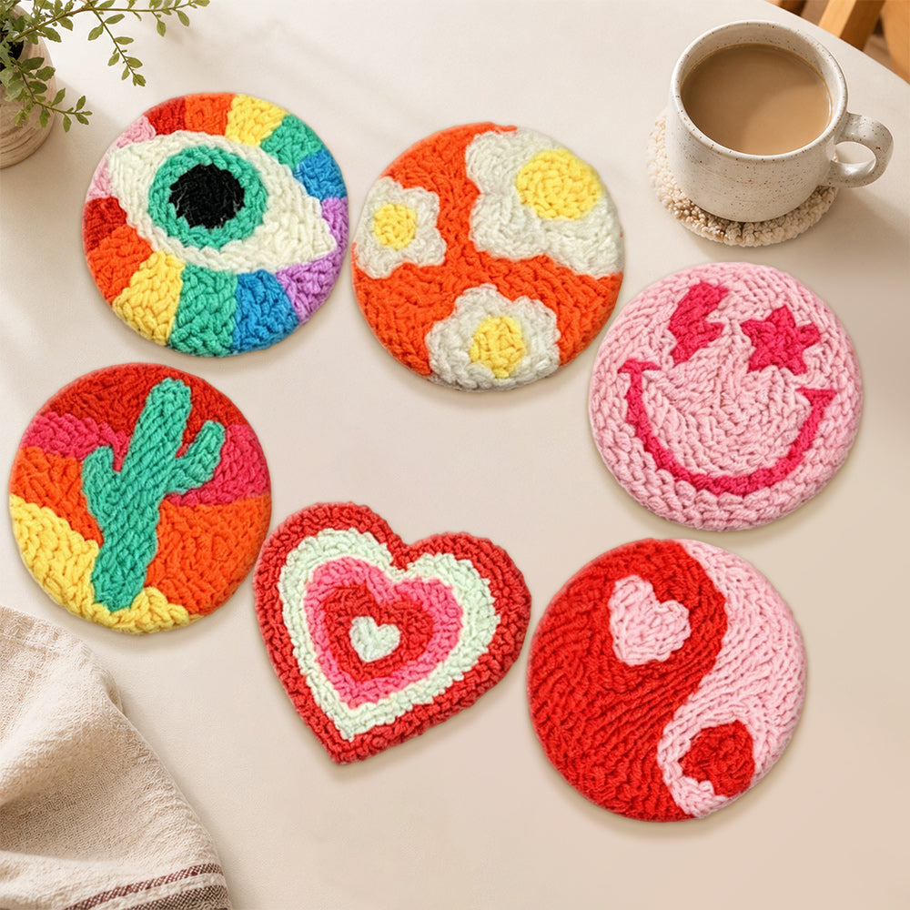 Smiley, cactus and heart punch needle coasters used for home decoration