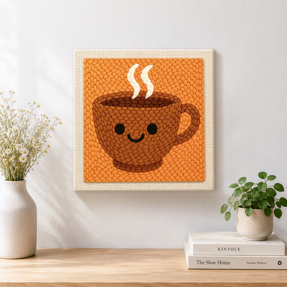 Finished smiley face coffee cup artwork displayed on a wall