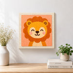 Finished smiling baby lion artwork displayed on a wall
