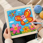 Creating handmade smiling butterflies and flowers punch needle artwork