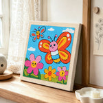Smiling butterflies and flowers punch needle artwork displayed on a table