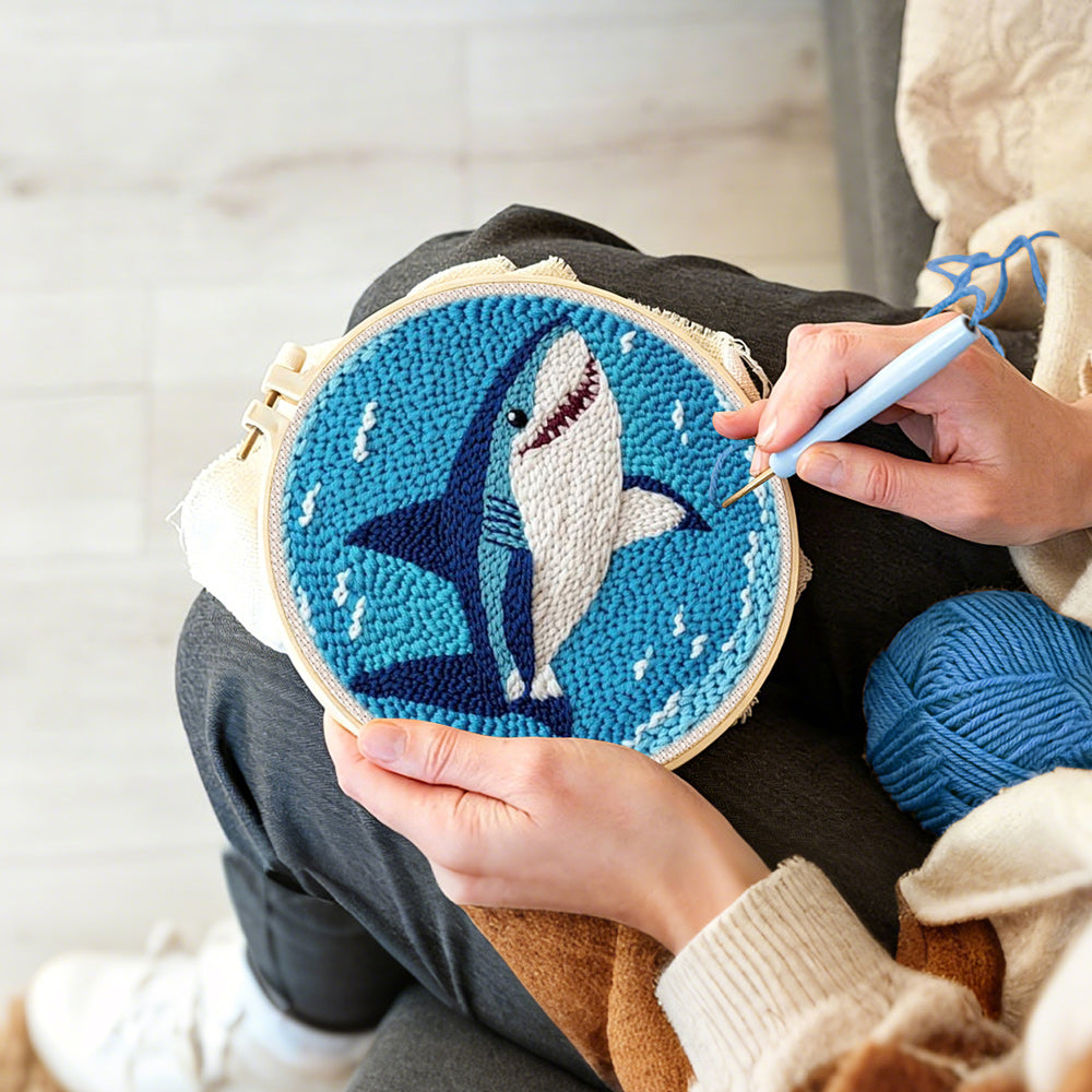 Creating handmade smiling deep-sea shark punch needle artwork