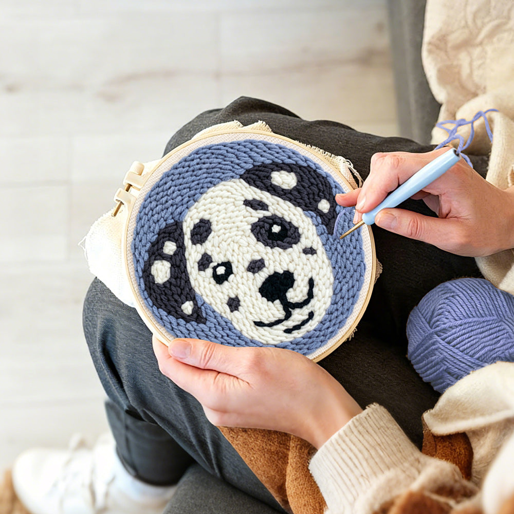Creating handmade smiling dog punch needle artwork